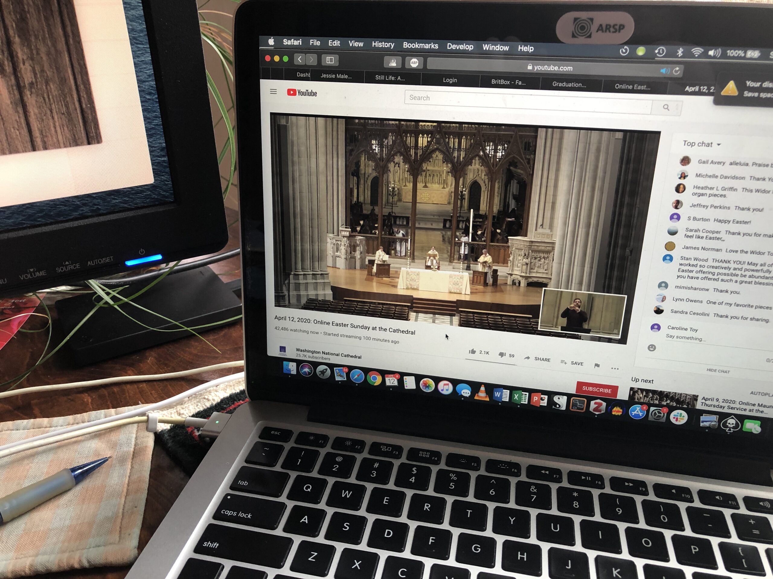 Open laptop, showing video from Washington National Cathedral on the left and a chat dialog on the right